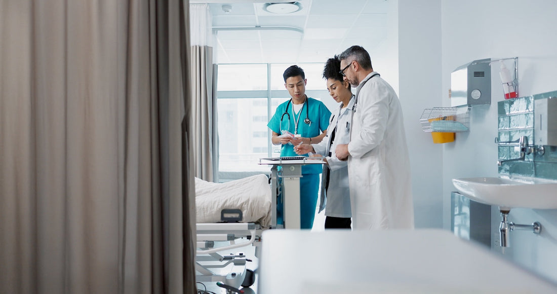 Hospital staff reviewing patient charts in a bright, modern room. Aromatherapy patient care.